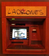 Near the stadium left-leaning locals have daubed a cashpoint. 'Ladrones' means 'thieves'