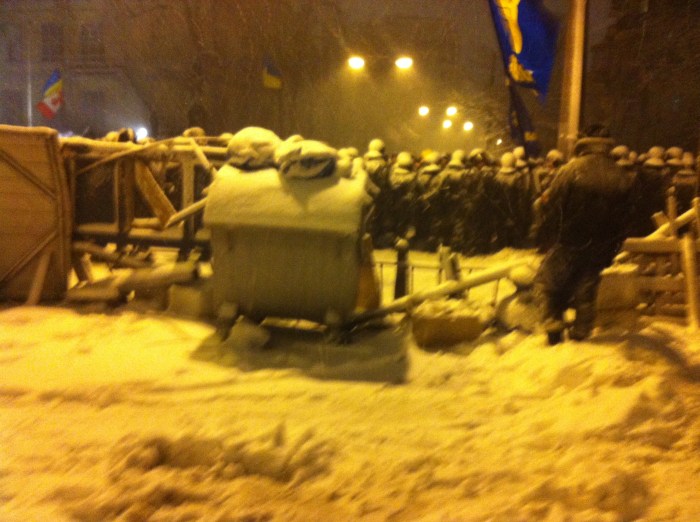 This is the view from within the small encampment in Lutheranska Street. Just behind me, the remaining camp members were huddled around an oil drum or, to the exit to the left, standing in a line in front of another line of riot police