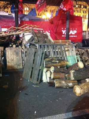 Wood is stockpiled by people who are, in effect, now living in Independence Square