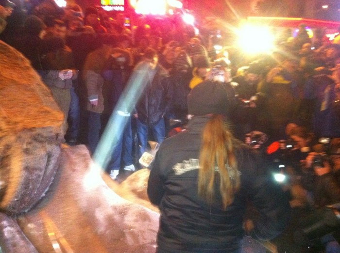 A woman wields the hammer to despatch Lenin in Kyiv