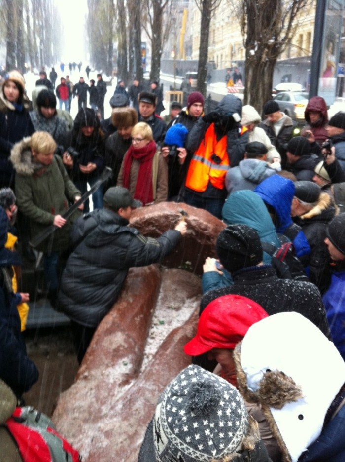 No hammer this time. Chips off Lenin's block are delicately teased off with what looks like a geologist's hammer